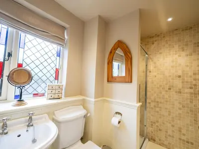 a bathroom with a toilet and a sink and a shower at The Old Chapel Charming countryside retreat - Pass the Keys in Ludlow