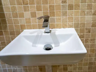 a white sink with a faucet in a bathroom at The Old Chapel Charming countryside retreat - Pass the Keys in Ludlow