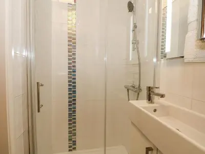 a bathroom with a shower and a sink at Plum Hill in Oswestry