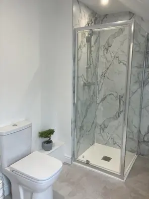 a bathroom with a shower and a toilet at Tedsmore Cottages in Oswestry
