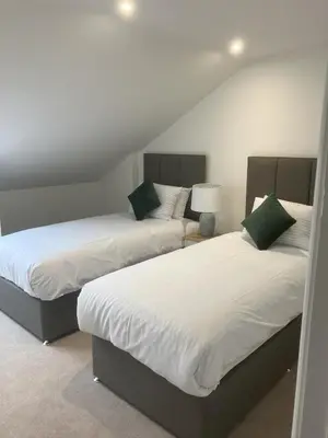 two beds sitting in a room with at Tedsmore Cottages in Oswestry