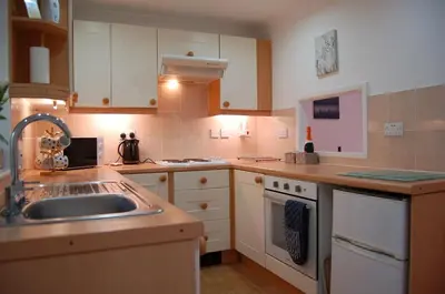 a kitchen with a sink and a counter top at No 6 at Dolgoch Falls Cottages in Bryn-crug