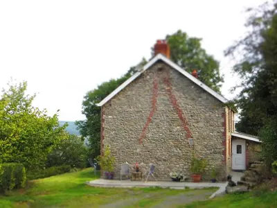 a building with a flag on the side of it at Character Apartment near the sea in Aberystwyth