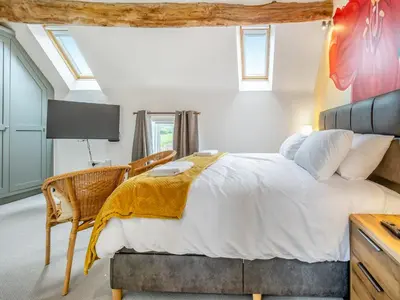 a bedroom with a large white bed and a desk at Orchard Barns - Uk47200 in Stapleton