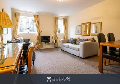 a living room with a couch and a tv at 2 Bed Shrewsbury Apartment in Great Location in Shrewsbury