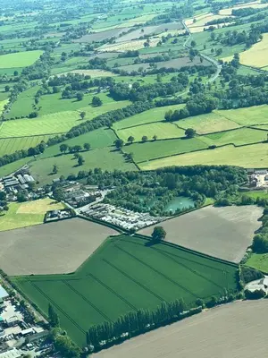 an aerial view of a village in the middle of a field at Weston glamping pod in Oswestry