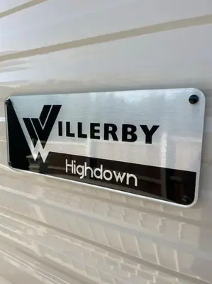 a sign on the side of a white car at Weston pools lodge in Oswestry