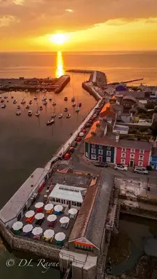 an aerial view of a harbor with boats in the water at Sea Breeze Lodge in Aberaeron