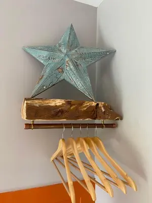 a blue star hanging on a wall with a bunch of bats at Sea Breeze Lodge in Aberaeron