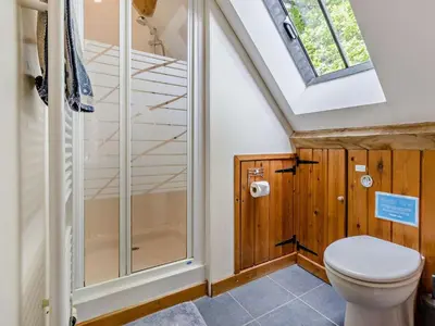 a bathroom with a toilet and a shower at 5 Bed in Craven Arms oc-95212 in Tugford