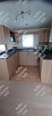a kitchen with white stencils on the ceilings at Kyffin 643 in Barmouth