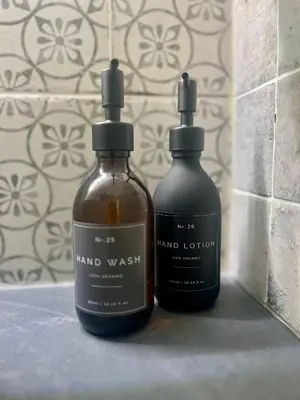 two bottles of hand wash sitting on a counter at Posh Little Cottage in Llangollen