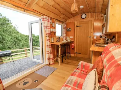 a view of a living room and kitchen in a tiny house at Shepherd's Cwtch in Llandovery