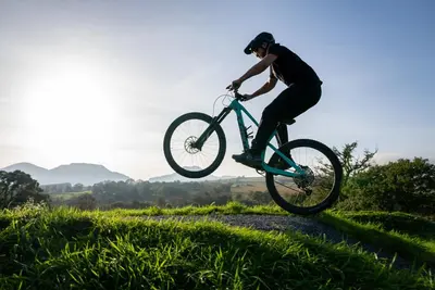 a person doing a trick on a bike in the air at MTB Jumps View Pod in Trawsfynydd