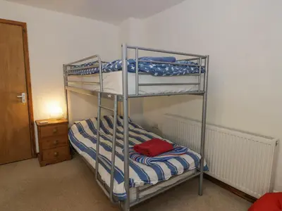 a bunk bed room with two bunk beds in it at Pennant Tigi Uchaf in Dolgellau