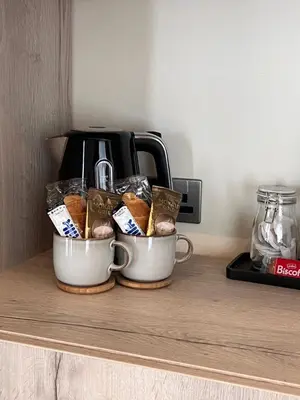two cups filled with pastries on a counter at Luxury Courtyard Studio in Llangollen in Llangollen