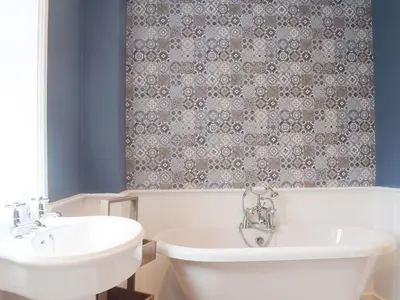 a bathroom with a white toilet and a sink at The Woodshed in Letton