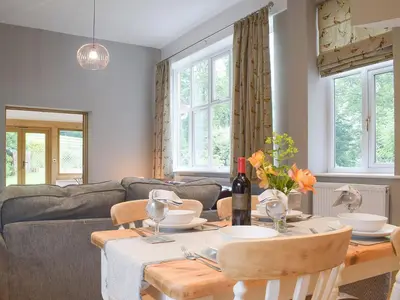 a living room with a table and a couch at The Woodshed in Letton