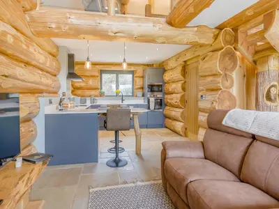 a kitchen and living room in a log cabin at Hope Hideaway in Leighton