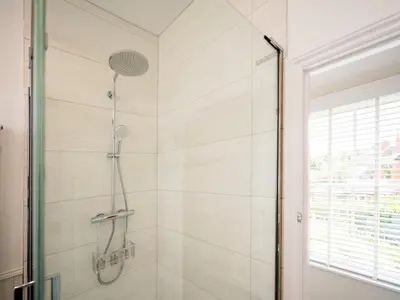 a bathroom with a shower with a glass door at School House Victorian elegance by the river with parking Pass the Keys in Shrewsbury