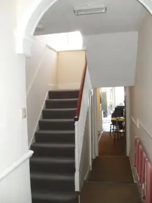 a staircase in a building with a stair case at Morawel in Aberystwyth