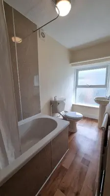 a bathroom with a large tub and a toilet at Morawel in Aberystwyth