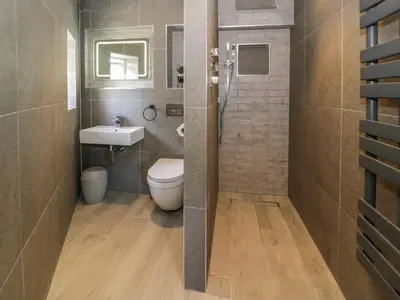 a bathroom with a toilet and a sink at Y Bwthyn in Dolgellau