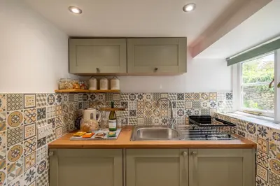 a kitchen with a sink and a counter top at Grade 2 Cottage 1 bedroom, Ludlow centre in Ludlow