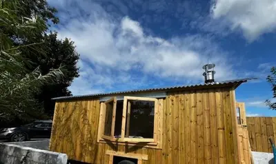 a small wooden house with a window on top of it at Little Dolwen - Sioned in Llanwenog