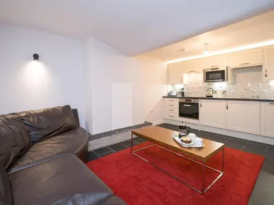a living room with a couch and a coffee table at 2 bedroom home within walking distance of the town - Pass the Keys in Shrewsbury