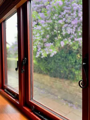 a window with a view of purple flowers outside at Frog Cottage, Ludlow - a charming townhouse for 4 in Ludlow