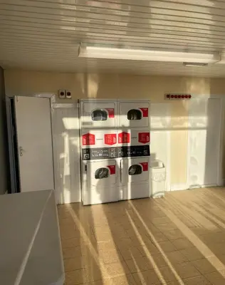 an empty room with an appliance in a building at Lovley 3 bedroom Static Caravan in Clarach Bay in Aberystwyth