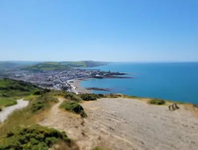 a view of a beach with a city and the ocean at Lovley 3 bedroom Static Caravan in Clarach Bay in Aberystwyth
