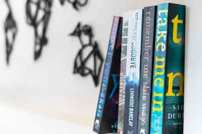 a row of books on a shelf at Sunday School House in Shrewsbury