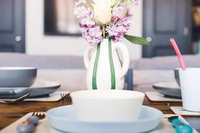 a vase with flowers in it sitting on a table at The Little Cygnet in Shrewsbury