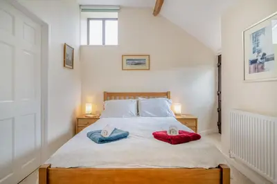a bedroom with a bed with two towels on it at 1 Bed in Hay-on-Wye oc-c29788 in Hay-on-Wye