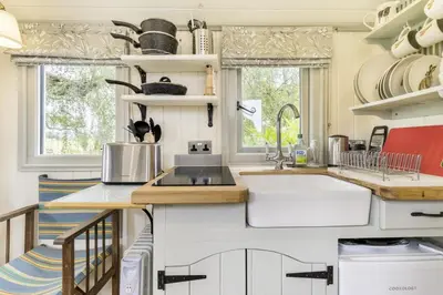 a kitchen with white cabinets and a sink at 1 Bed in Leintwardine oc-b29785 in Brampton Bryan
