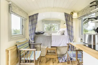 a bedroom with a bed and a table and chairs at 1 Bed in Leintwardine oc-b29785 in Brampton Bryan