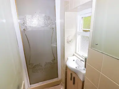 a bathroom with a shower and a sink at Morva in New Quay
