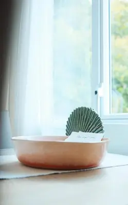 a bowl with a brush in it next to a window at Foxglove Lodge in New Quay