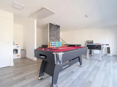 a room with a ping pong table and a pool at The Willows in Llangollen