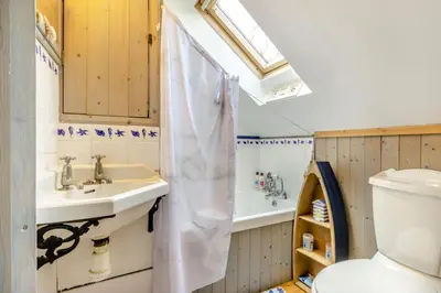 a bathroom with a sink and a toilet and a tub at 3 Bed in Llwynygroes oc-t29715 in Llangeitho