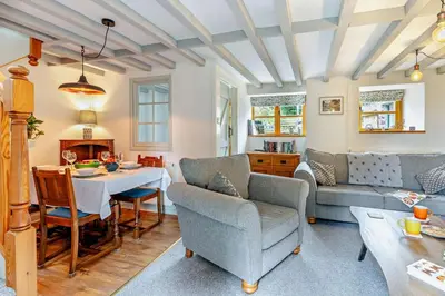a living room with a couch and a table at 2 Bed in Crugybar oc-t29740 in Rhandirmwyn