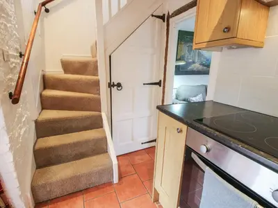a staircase in a tiny house at Moorhen Cottage in Ludlow