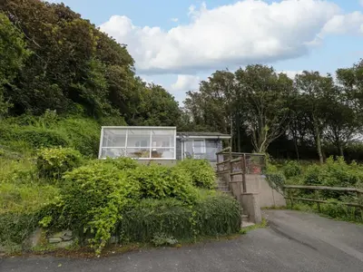 a house on the side of a hill at Woodland Roost in Barmouth
