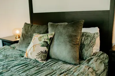 a bed with pillows on top of it at Kestrel lodge in Wrexham