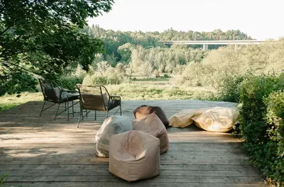a group of people sleeping in bags on a patio at Kestrel lodge in Wrexham
