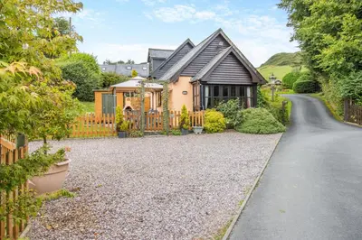 a house with a fence and a gravel driveway at 2 Bed in Devils Bridge oc-d29575 in Devils Bridge