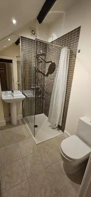 a bathroom with a shower and a toilet and a sink at Class Stays in Shrewsbury