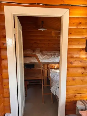 a small room with a bed in a cabin at Gwel-y-Cwm - Valley View in Trawsfynydd